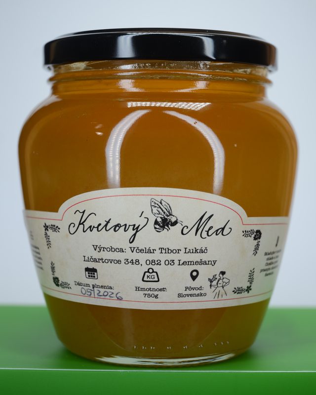 Sklo zlatého medu s etiketou Kvetový med, 750 g.